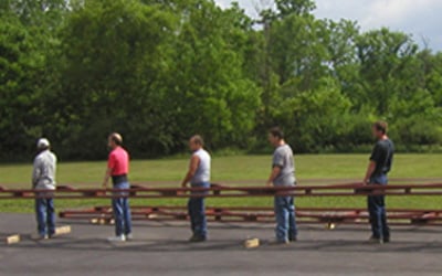 Volunteers Installation a Fiberglass Pedestrian Bridge