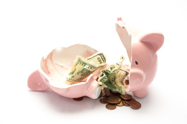 Piggy bank broken with money inside on white background.jpeg