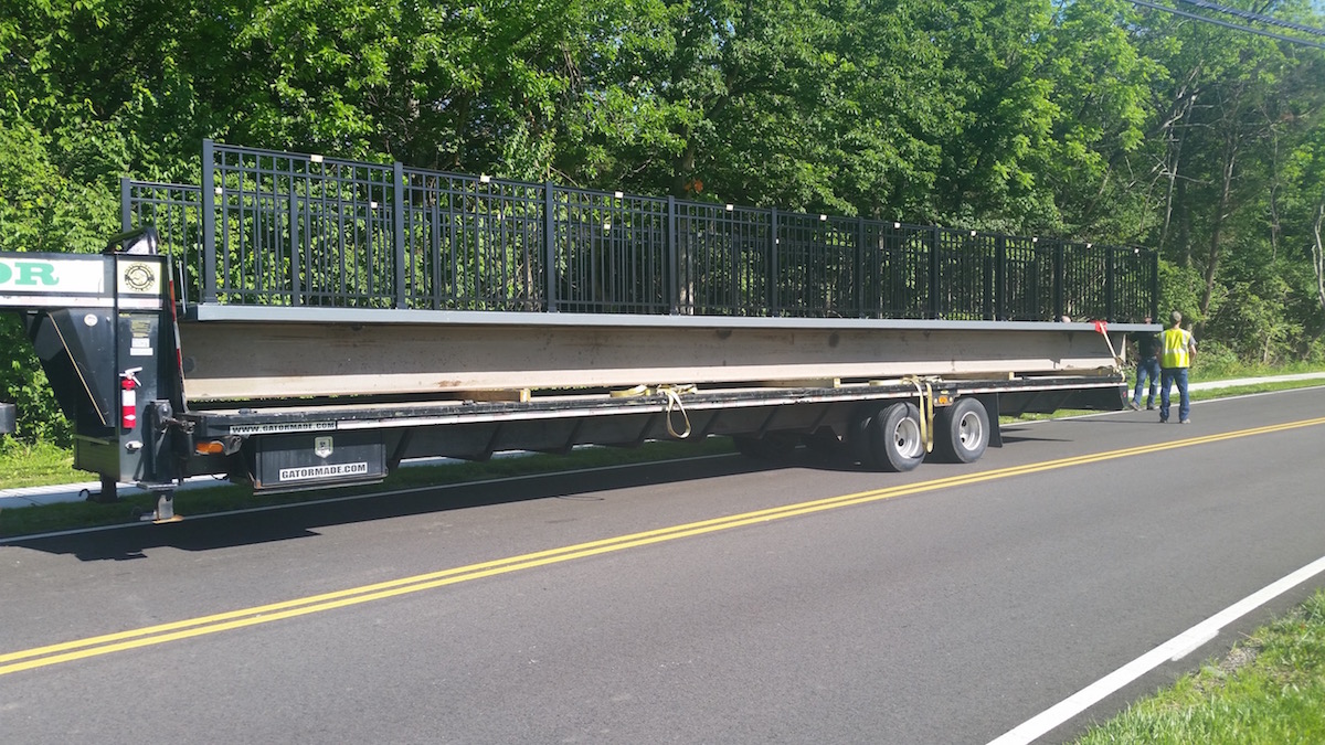 1. The prefabricated bridge arrives at the park ready for installation..jpg