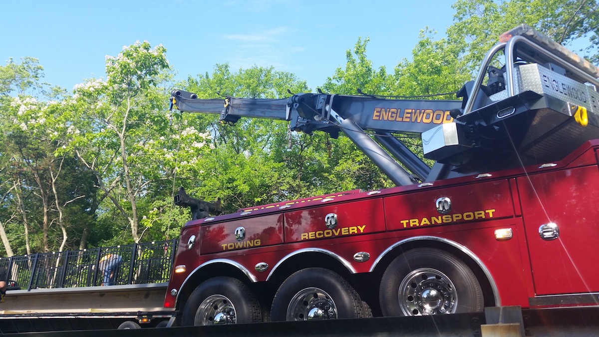 2. A crane lifts the bridge off the truck and to its installation spot..jpg