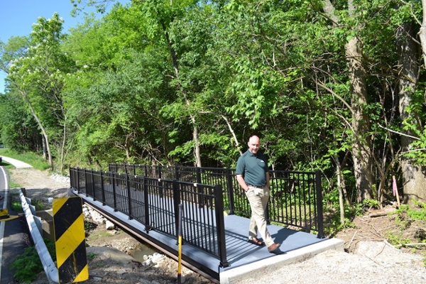 6. The first pedestrian walking across the newly installed bridge..jpg